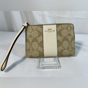 2036: Coach monogram Tan and Cream Wristlet EUC